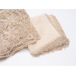 Rectangular Burano lace tablecloth featuring rich floral motifs on a mesh background. Includes twelve napkins.