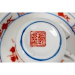 A set of Oriental porcelain consisting of two cups with saucers and a soup spoon