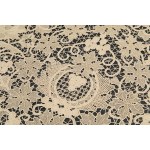 A richly decorated rectangular tablecloth featuring floral motifs in linen and lace, with twelve matching napkins