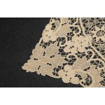 A richly decorated rectangular tablecloth featuring floral motifs in linen and lace, with twelve matching napkins