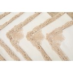 A richly decorated rectangular tablecloth featuring floral motifs in linen and lace, with twelve matching napkins