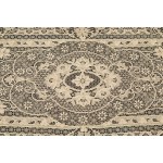 A richly decorated rectangular tablecloth featuring floral motifs in linen and lace, with twelve matching napkins