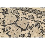 A richly decorated rectangular tablecloth featuring floral motifs in linen and lace, with twelve matching napkins
