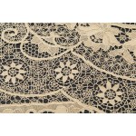 A richly decorated rectangular tablecloth featuring floral motifs in linen and lace, with twelve matching napkins