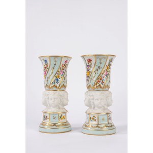 Pair of porcelain vases with biscuit-colored cherub heads