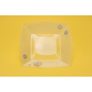Clear glass bread basket with silver foil daisy inserts.