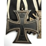 A BADGE WITH TWO WORLD WAR I DECORATIONS—THE IRON CROSS, 2ND CLASS, 1914, AND THE HINDENBURG CROSS WITH SWORDS
