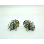 A pair of silver peacock-shaped business card holders, enamel