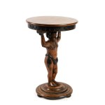 A table with a carved figure of a boy