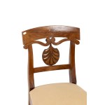 A pair of Empire-style chairs