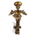 A wall sconce shaped like a winged satyr