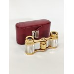 Small gold-plated binoculars with mother-of-pearl in a case