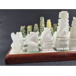 Stone chess set (white and green onyx or marble). Hawaiian Tiki or Mexican (Aztec/Mayan). 20th century.