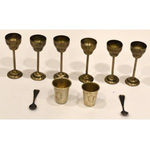 Set of silver glasses with spoons