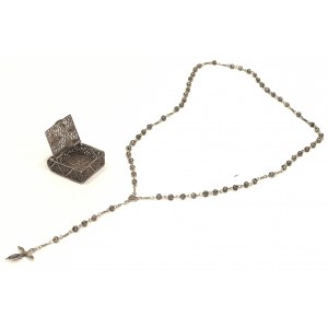 Silver rosary in filigree case