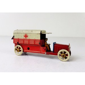 [AMBULANS]. Metalowy ambulans oznaczony czerwonym krzyżem.