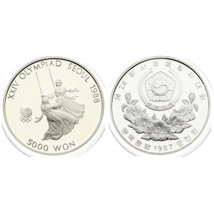 Korea-South 5000 Won 1987 1988 Olympics. Averse: Arms above floral spray. Reverse: Girls on swing. Silver...