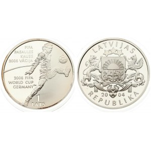 Latvia 1 Lats 2004 Averse: Arms with supporters. Reverse: World Cup Soccer player. Edge Lettering: LATVIJA three times...