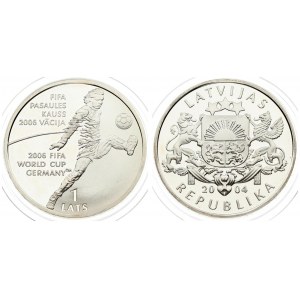 Latvia 1 Lats 2004 Averse: Arms with supporters.Reverse: World Cup Soccer player. Edge Lettering: LATVIJA three times...