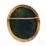 An oval brooch painted with Amor