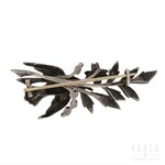 A brooch modelled as a bird with a flowering branch