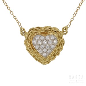 A diamond paved heart shaped pendant