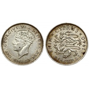 Cyprus 9 Piastres 1940 George VI(1936-1952). Averse: Crowned head left. Reverse: Two stylized rampant lions left...