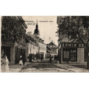 1916 Károlyváros, Karlovac; Rakovacka ulica / street view with the shops of Armin Ben. and Ivan Lach...