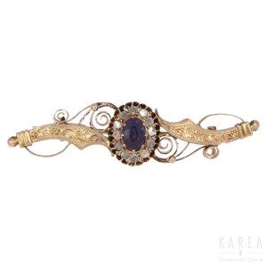 A scroll decorated and sapphire bar brooch, Russia, late 19th century