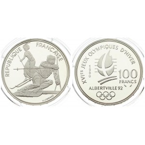 France 100 Francs 1990 1992 Olympics. Averse: Slalom skiers. Reverse: Crossed flame; date and denomination; logo below...
