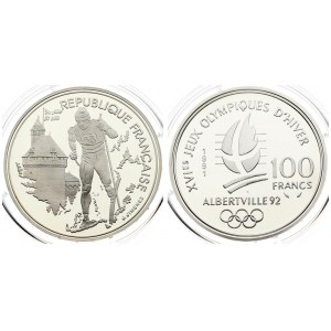 France 100 Francs 1991 1992 Olympics. Averse: Cross-country skier; building at left. Reverse: Crossed flame...