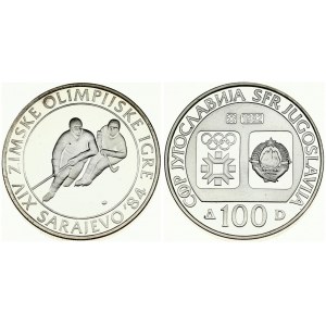 Yugoslavia 100 Dinara 1982 Ice Hockey. Averse: Emblem and Olympic logo on separate shields within flat bottom circle...