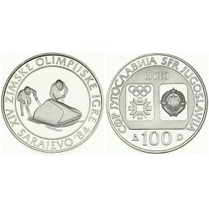 Yugoslavia 100 Dinara 1983 Bobsledding. Averse: Emblem and Olympic logo on separate shields within flat bottom circle...