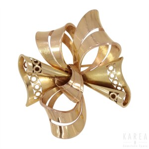 A brooch modelled as a stylised bow, France, 1960s-70s