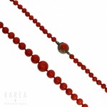 A single strand polished coral bead necklace, late 19th/early 20th century