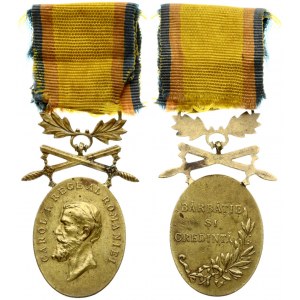 Romania Medal (1914) Manhood and Loyalty.  BĂRBĂTIE SI CREDINTĂ. Medal for Manhood and Loyalty with Swords in Bronze...