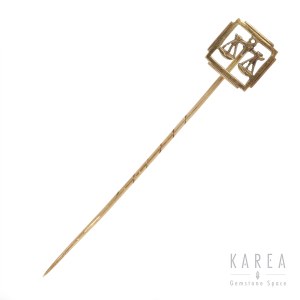 Tie pin with zodiac scales motif, 20th century.