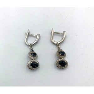 Boucles d'oreilles argentées avec yeux verts