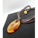 Staggering Amber Pendant with chain, shaped like a Drop