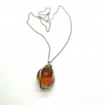Unique and Exquisite Amber Pendant with chain, shaped like a Ball