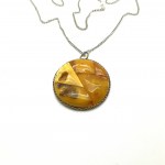 Unique and Remarkable Amber Pendant with chain, shaped like a Circle