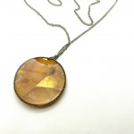 Unique and Remarkable Amber Pendant with chain, shaped like a Circle
