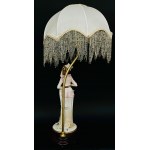 Figural lamp with lampshade