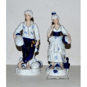Porcelain figurines of a woman and a man.
