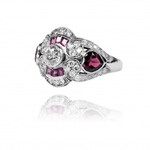 Ring with diamonds and garnets made of gold