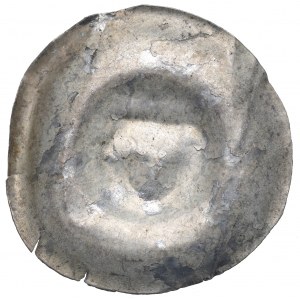Slezsko, náramek ze 13. století, hlava s očima naproti sobě