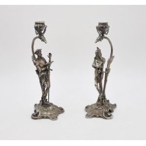 J. FRAGET - FABRYKA WYROBÓW SREBRNYCH I PLATEROWANYCH (czynna 1824-1944), Para świeczników z figurkami Don Kichota i Mefistofelesa