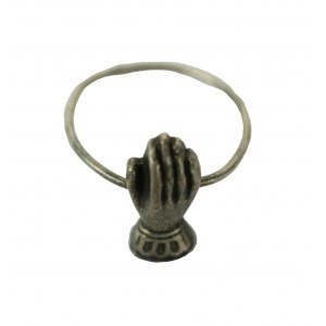 Ring with a hand-shaped element