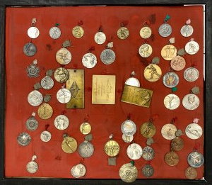 Collection of Sports Medals in a display case + two display cases