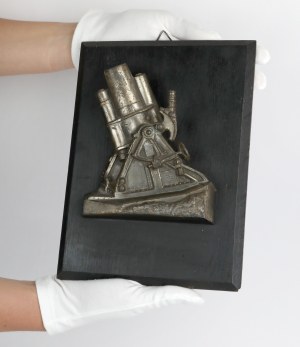 Bas-relief with the image of a cannon / cannon